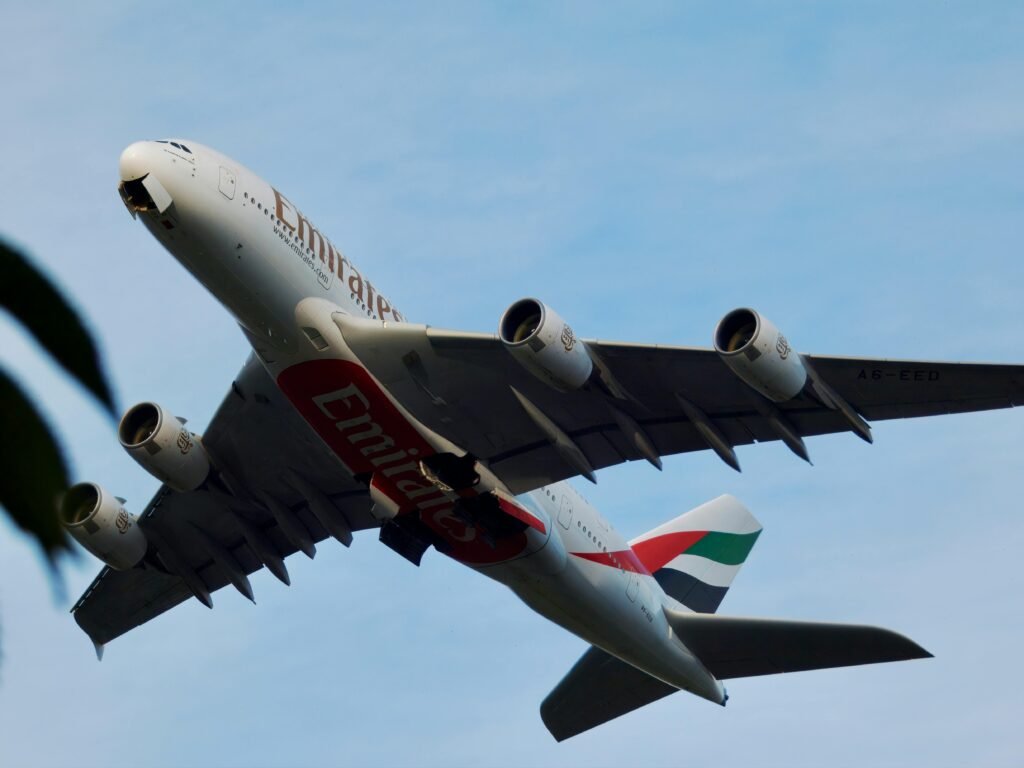 Low angle view of Emirates Airbus A380 ascending.