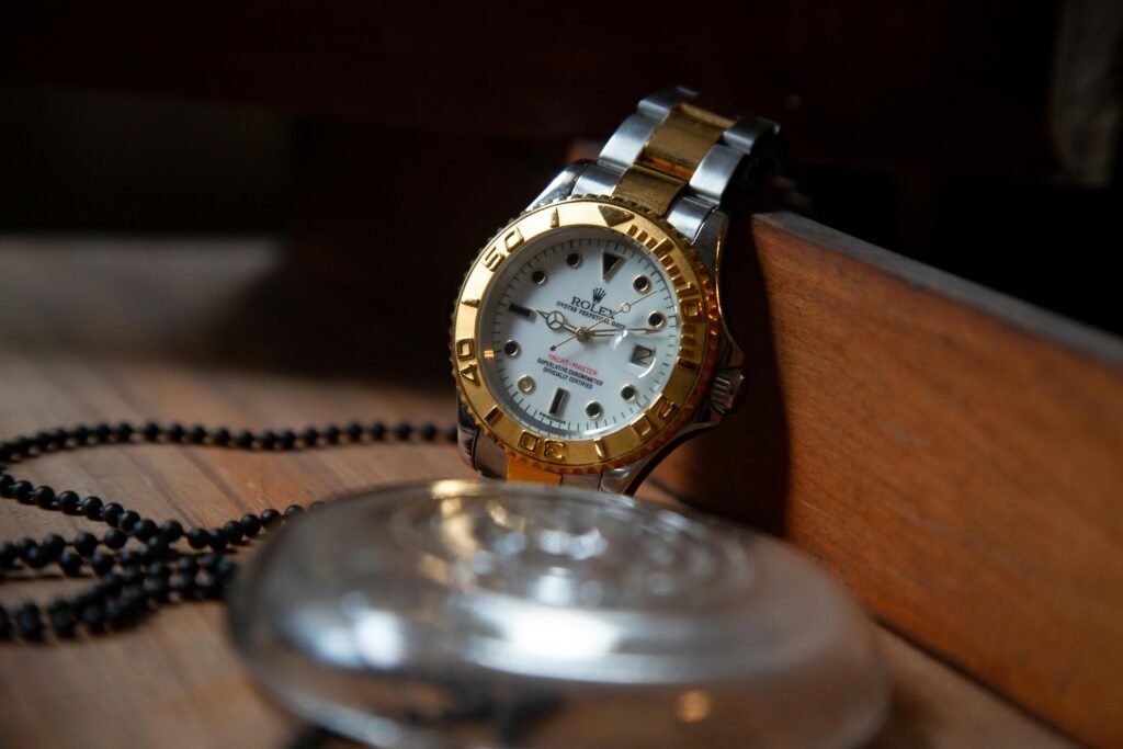 Close-up of a luxury Rolex wristwatch with gold and silver detailing, symbolizing elegance and precision.